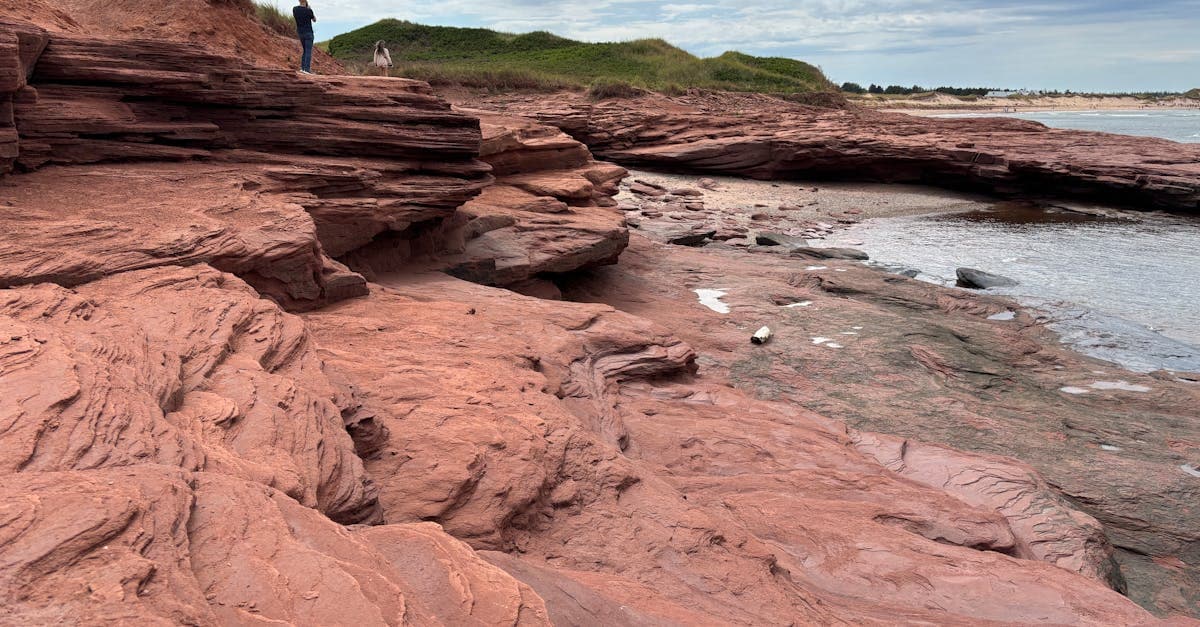Red sandstone cliffs along the scenic shoreline of Cavendish, Prince Edward Island