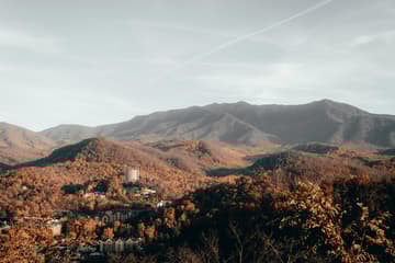 Breathtaking view of Gatlinburg's Smoky Mountains in fall with vibrant foliage and serene scenery