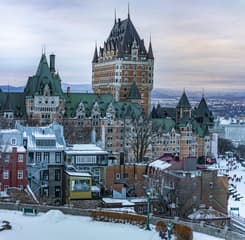 Iconic Château Frontenac lit up in winter snow, capturing Quebec City's historic charm during Carnaval de Québec
